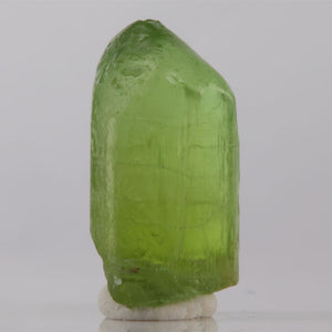 Raw green Peridot Crystal on white background