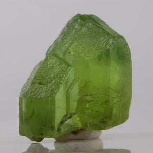 Green crystal on a white background