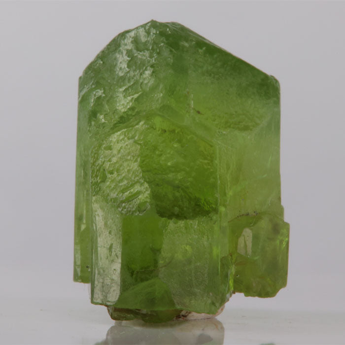 Green crystal on a gray background