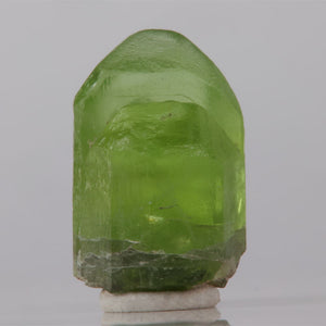 Green crystal on a gray background
