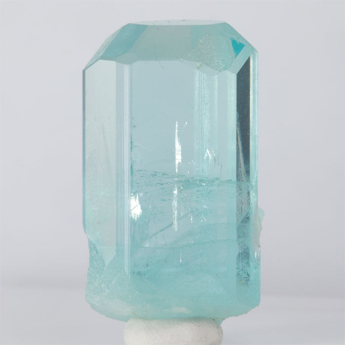 Teal Aquamarine crystal on a white background