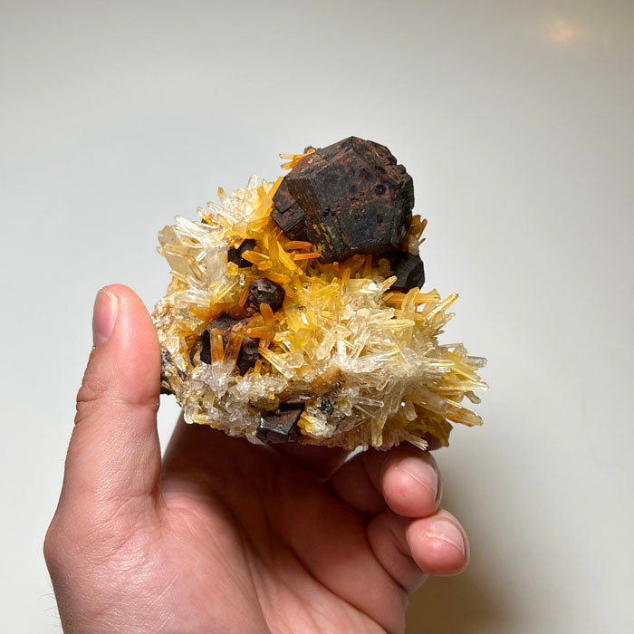 Large quartz specimen featuring reddish brown pyrite crystals