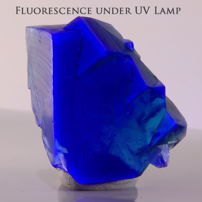 Natural green fluorite from Rogerley Mine in England showing stepped crystal growth and translucent cubic faces.