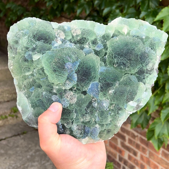 large emerald green fluorite cluster displaying rounded botryoidal crystal growth