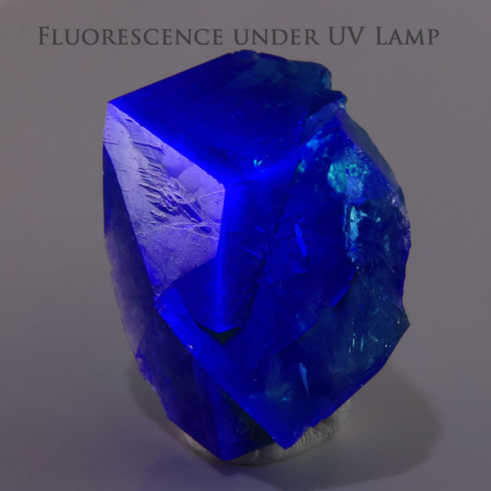 Daylight fluorescent fluorite from Rogerley Mine featuring rich green color that develops blue-green tones in natural daylight.