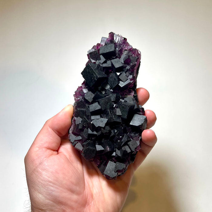 collector fluorite specimen featuring deep violet cube formations from China