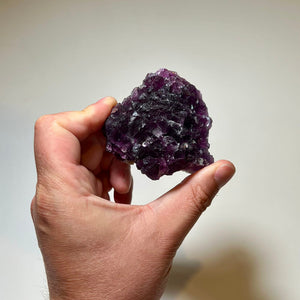 Deep violet cubic fluorite crystals on matrix