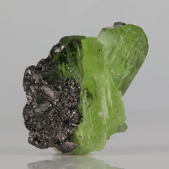 green diopside crystal on graphite matrix Tanzania