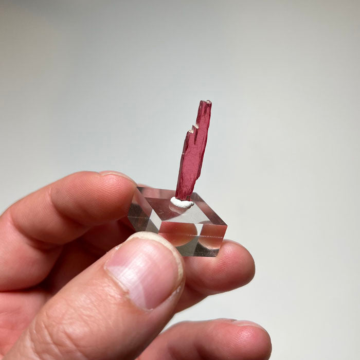 Elongated translucent Rhodonite mineral specimen