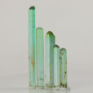 five piece tourmaline crystal lot bright green slender crystals
