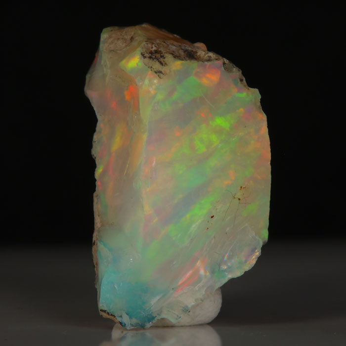 Welo opal specimen with matrix and colorful flashes