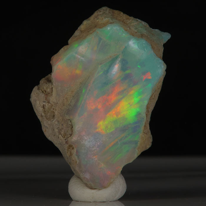 Ethiopian Welo opal with strong green red orange play of color