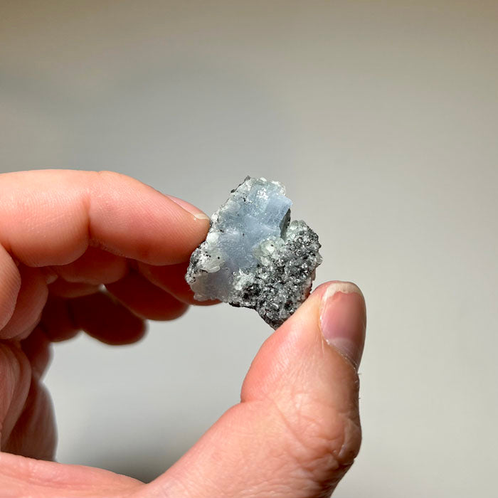 Tanzanian blue prehnite mineral specimen on matrix
