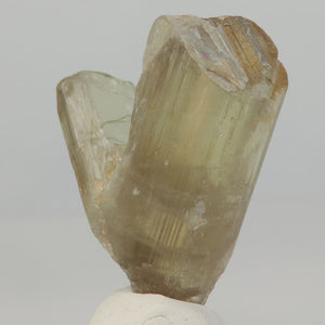 transparent diaspore crystal under fluorescent lighting