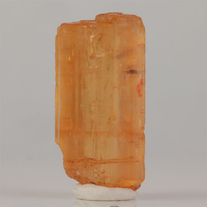 Imperial topaz crystal from Ouro Preto Brazil with golden orange color and large size