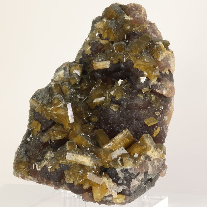 Lustrous tabular barite crystals covering fluorite matrix