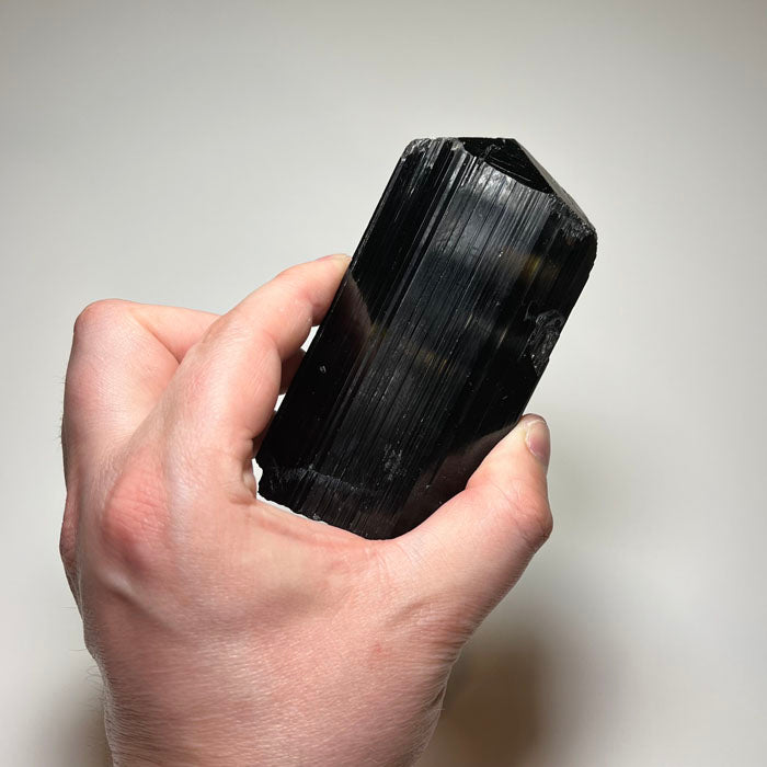 natural black tourmaline crystal vertical striations