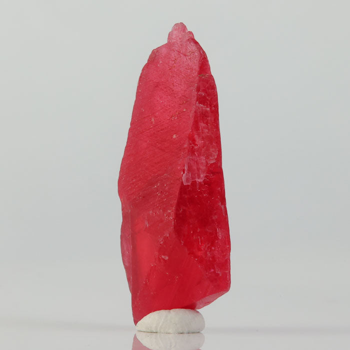 large pink rhodonite specimen from brazil elongated thumbnail mineral