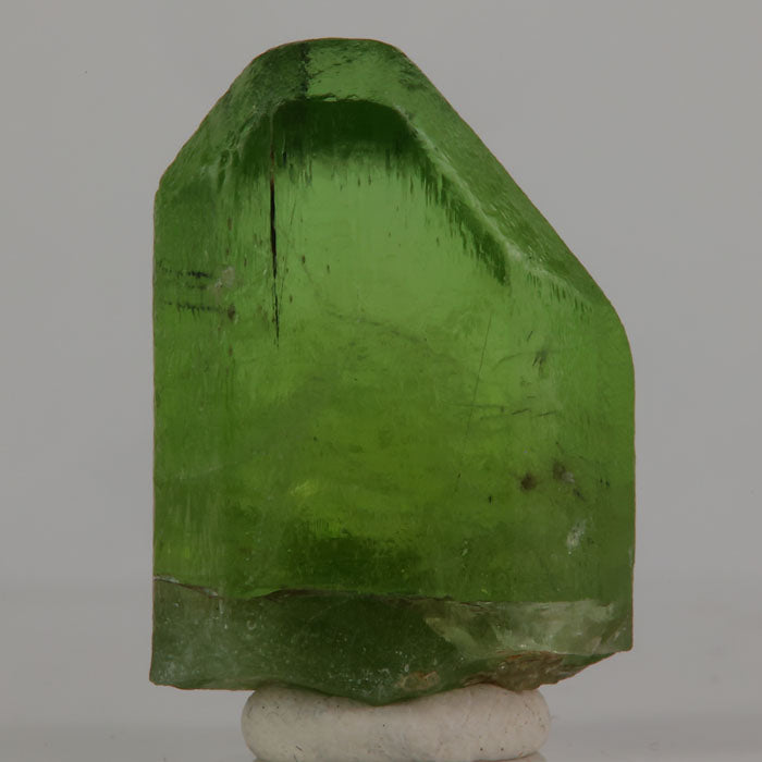 Large green peridot crystal specimen from Pakistan with strong color and form