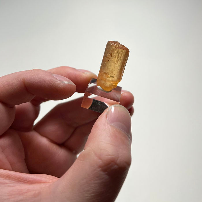 Imperial topaz crystal from Ouro Preto Brazil with golden orange color and large size