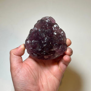 densely packed fluorite crystal rosettes in shades of purple and violet