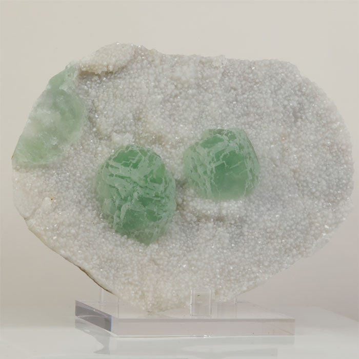 Mint green fluorite crystals on white druzy matrix from Jiangxi China