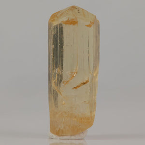 Scapolite crystal specimen with elongated structure and internal features