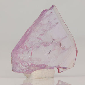 Thin magnesio-axinite crystal displaying internal veils and natural luster