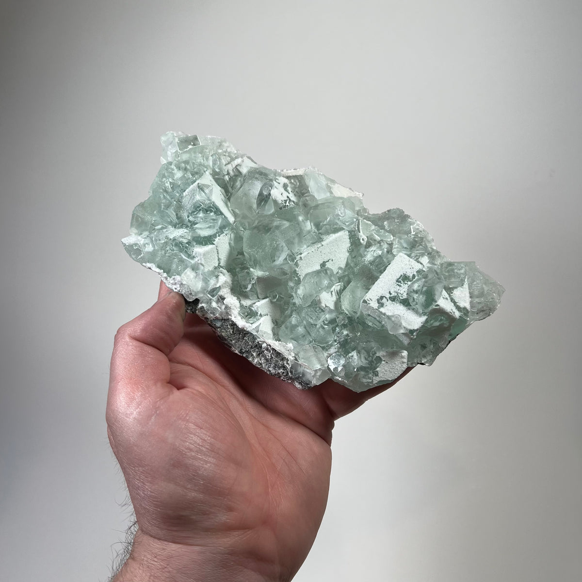 Natural green fluorite specimen with cubic crystals