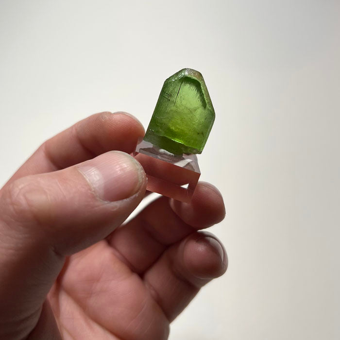 Large green peridot crystal specimen from Pakistan with strong color and form