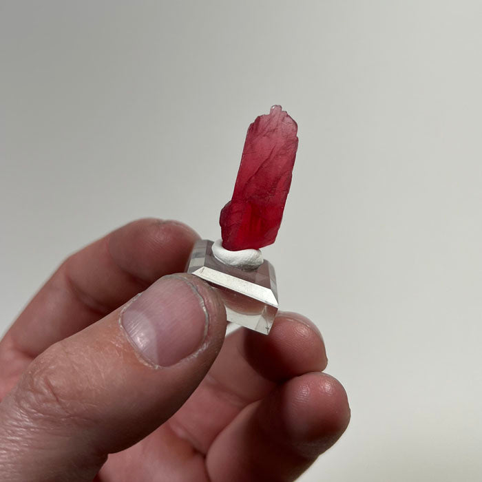 large pink rhodonite specimen from brazil elongated thumbnail mineral