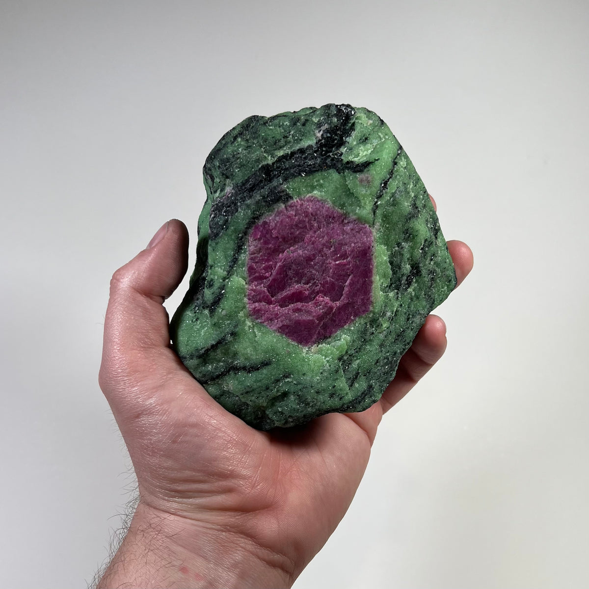 Natural ruby crystal in green zoisite matrix