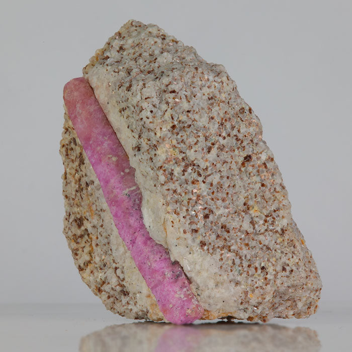 ruby in matrix with elongated crystal and strong color