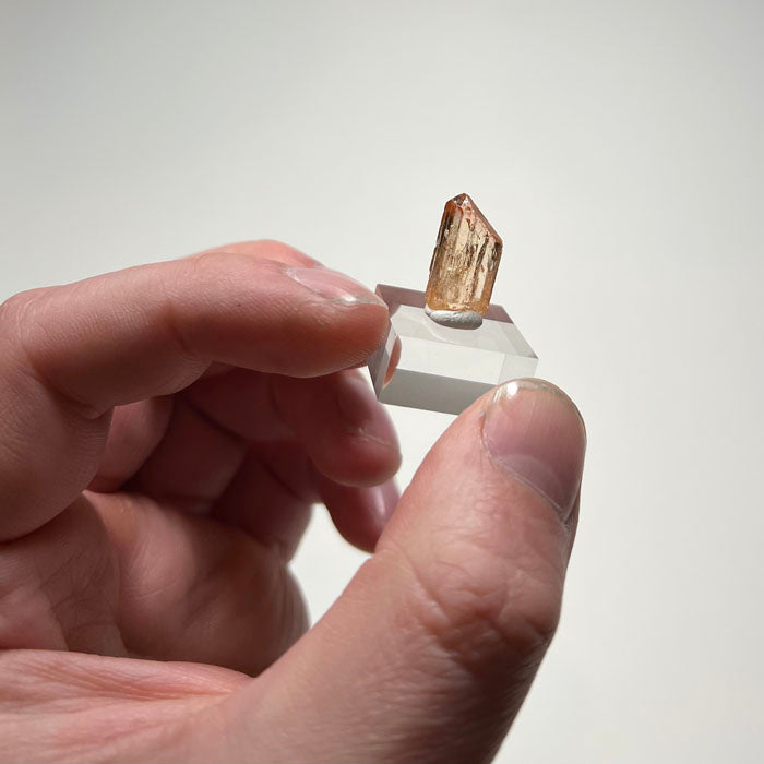 Natural topaz crystal showing prismatic form and vertical striations