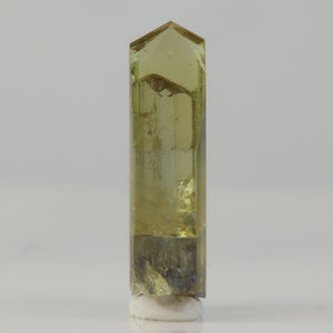 transparent zoisite crystal with patchy violet coloration