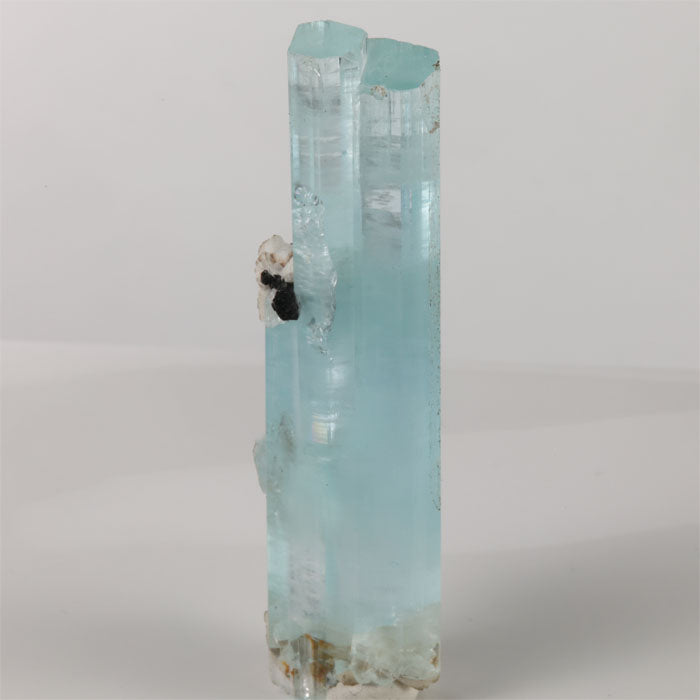 Natural 51.50 gram aquamarine specimen showing transparent hexagonal terminations and a small side crystal.