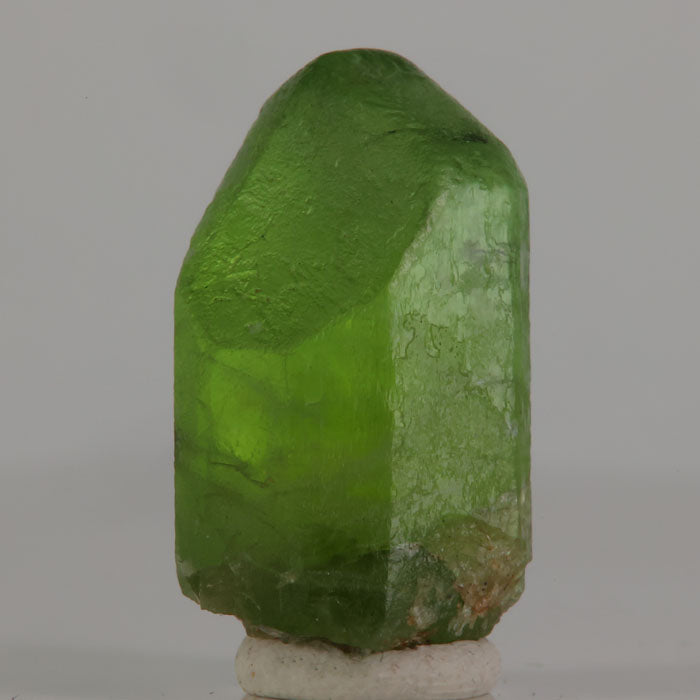 Pakistani peridot crystal with broad faces and visible internal inclusions