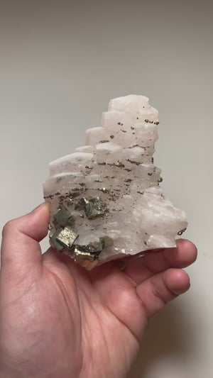 calcite crystal cluster with metallic pyrite cubes