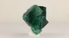 Natural daylight fluorescent Rogerley Mine fluorite from England with complex geometric crystal growth and blue-green fluorescent characteristics.