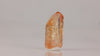 Brazilian topaz specimen with warm orange hues and natural termination