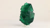Side view of Rogerley Mine fluorite showing transparent green crystal edges, intergrown formations, and natural surface textures.