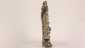 large pyrite specimen with green fluorite crystals