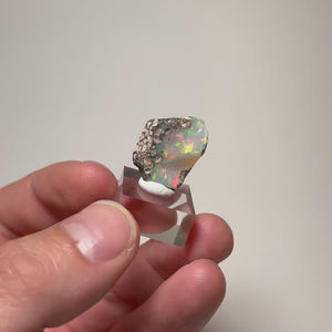 Colorful Ethiopian opal rough with attached natural matrix
