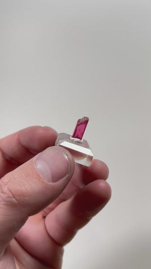 bright rhodonite thumbnail specimen with translucent structure