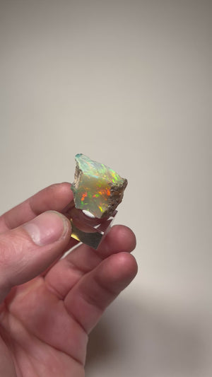 Welo opal specimen with matrix and colorful flashes