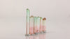 raw tourmaline crystal group with green and pink tones