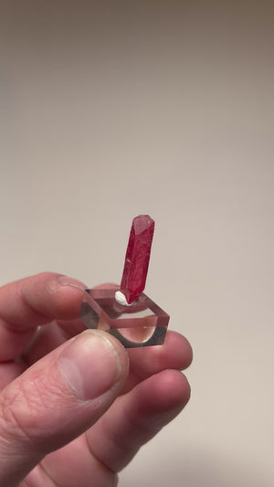 Triclinic rhodonite crystal with saturated pink color and smooth luster