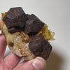 Quartz matrix featuring several large pyrite crystal forms