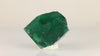 Front view of natural Rogerley fluorite from England showing overlapping cubic faces and rich emerald-green coloration.
