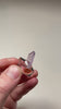 Fluorescent magnesio-axinite specimen with bright orange UV reaction